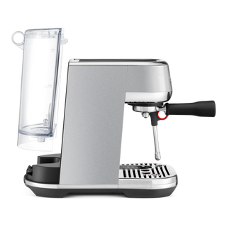 A modern espresso machine with a brushed silver metallic body, black accents, a clear water tank, and a black steam wand handle, shown on a plain white background.